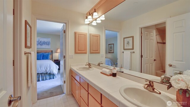 8504 146th Pl SE, Newcastle, WA 98059 - ensuite bathroom featuring double vanity, washtub / shower combination, and tile patterned flooring