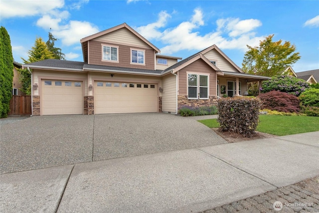 6103 153rd Ave E, Sumner, WA 98390 - craftsman-style home featuring stone siding, driveway, and an attached garage