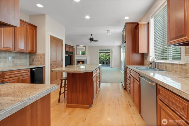 6103 153rd Ave E, Sumner, WA 98390 - kitchen with stainless steel appliances, ceiling fan, open floor plan, a kitchen island, and recessed lighting