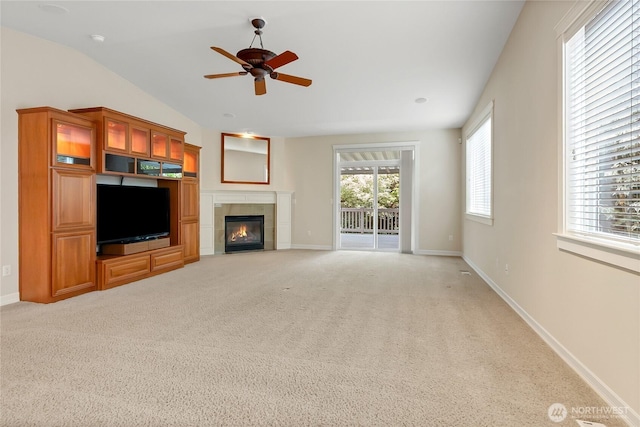 6103 153rd Ave E, Sumner, WA 98390 - unfurnished living room with a ceiling fan, a tile fireplace, and light colored carpet