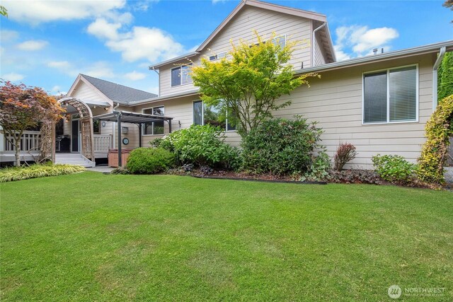 6103 153rd Ave E, Sumner, WA 98390 - back of property featuring a wooden deck and a lawn