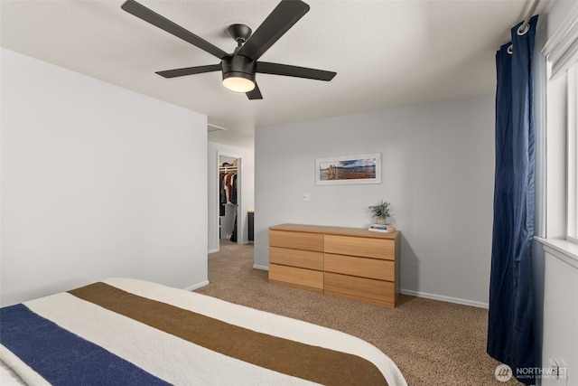 4434 Juli Ct SE, Olympia, WA 98501 - bedroom featuring carpet, a spacious closet, and a ceiling fan