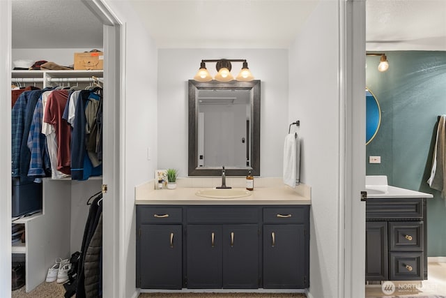 4434 Juli Ct SE, Olympia, WA 98501 - bathroom featuring two vanities and a spacious closet