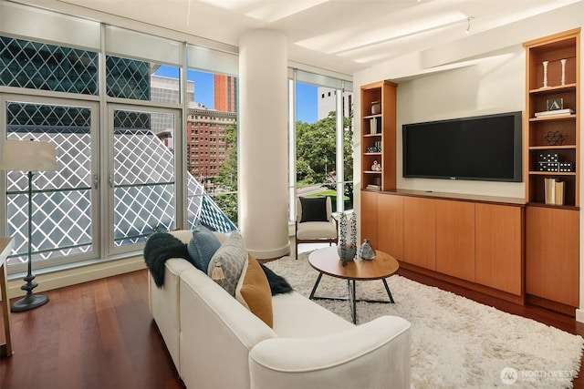 909 5th Ave Unit 303, Seattle, WA 98164 - living room featuring wood finished floors