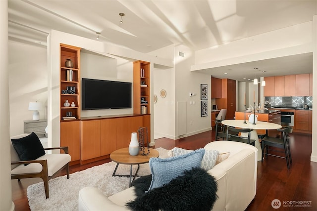 909 5th Ave Unit 303, Seattle, WA 98164 - living room featuring dark wood finished floors