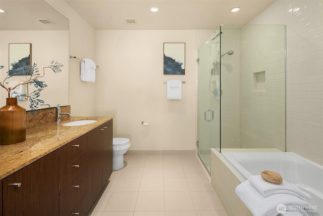 909 5th Ave Unit 303, Seattle, WA 98164 - full bath featuring a shower stall, vanity, a garden tub, recessed lighting, and tile patterned flooring