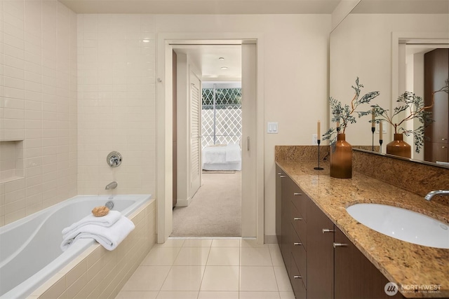 909 5th Ave Unit 303, Seattle, WA 98164 - full bathroom with tiled bath, tile patterned floors, vanity, ensuite bathroom, and baseboards