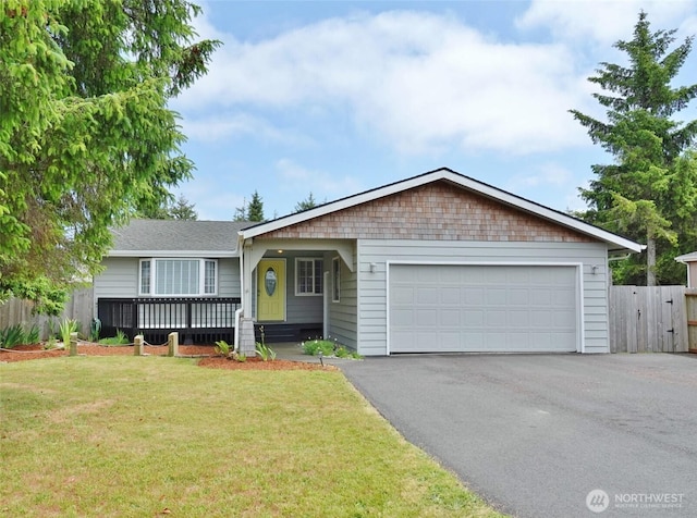 137 S Razor Clam Dr SW, Ocean Shores, WA 98569 - ranch-style home featuring asphalt driveway and an attached garage