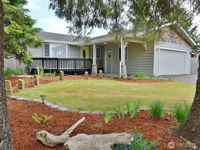 137 S Razor Clam Dr SW, Ocean Shores, WA 98569 - ranch-style house with a garage, a front lawn, driveway, and a deck