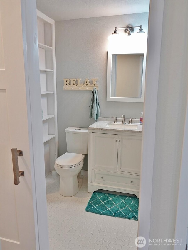 137 S Razor Clam Dr SW, Ocean Shores, WA 98569 - bathroom with vanity and toilet