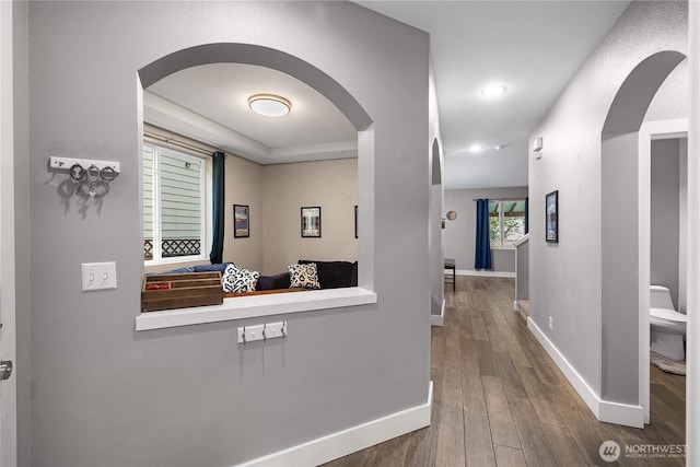 6858 Flute St SE, Lacey, WA 98513 - hall with arched walkways, baseboards, wood finished floors, and recessed lighting
