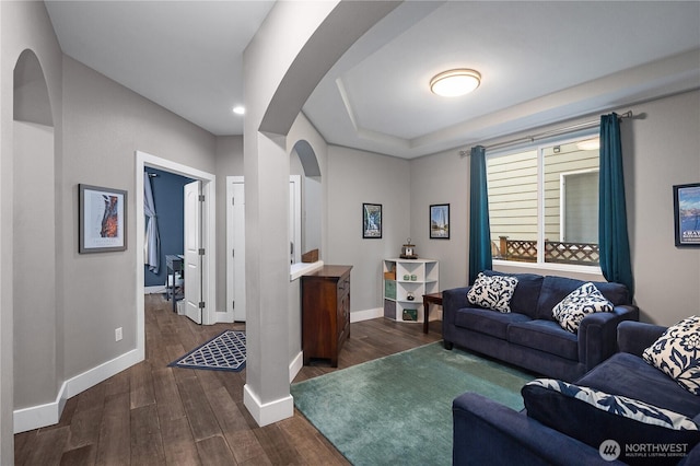 6858 Flute St SE, Lacey, WA 98513 - living room featuring arched walkways, dark wood-style floors, baseboards, and recessed lighting