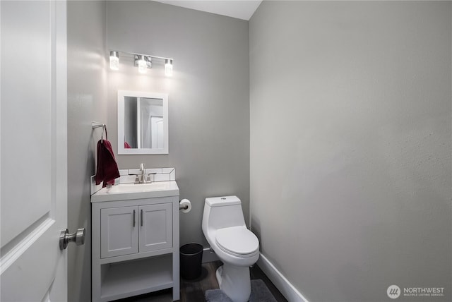6858 Flute St SE, Lacey, WA 98513 - half bathroom with vanity, toilet, and baseboards