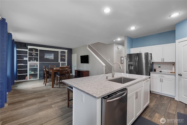 6858 Flute St SE, Lacey, WA 98513 - kitchen featuring refrigerator with ice dispenser, a sink, stainless steel dishwasher, white cabinets, and recessed lighting
