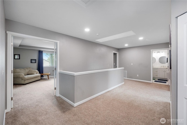 6858 Flute St SE, Lacey, WA 98513 - corridor with carpet floors, baseboards, a skylight, and recessed lighting