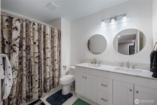 6858 Flute St SE, Lacey, WA 98513 - bathroom featuring double vanity, toilet, tile patterned flooring, and a shower with shower curtain