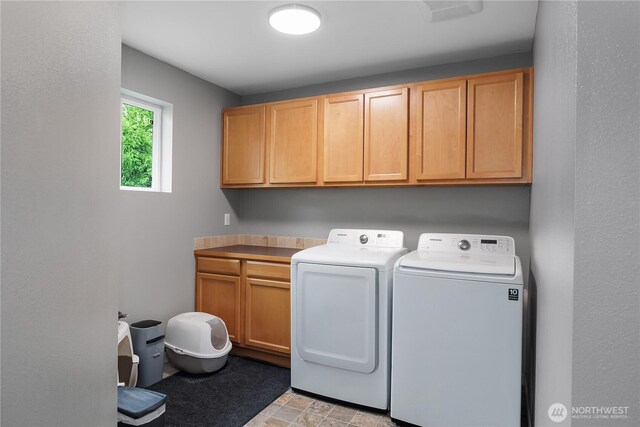6858 Flute St SE, Lacey, WA 98513 - laundry room featuring cabinet space and washer and clothes dryer