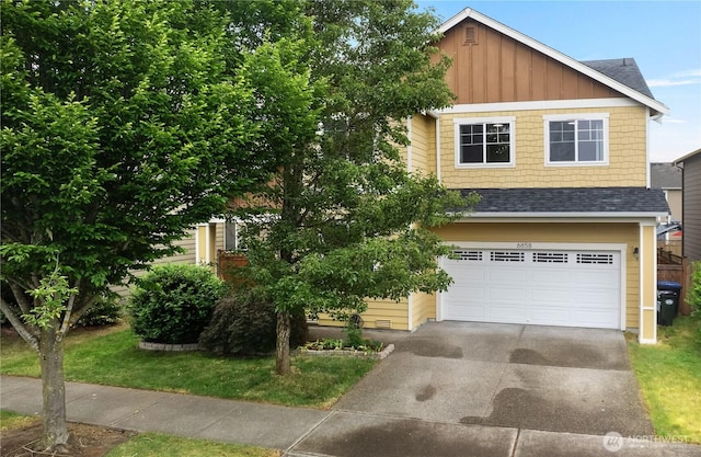 6858 Flute St SE, Lacey, WA 98513 - view of front of home featuring concrete driveway, board and batten siding, roof with shingles, and a garage
