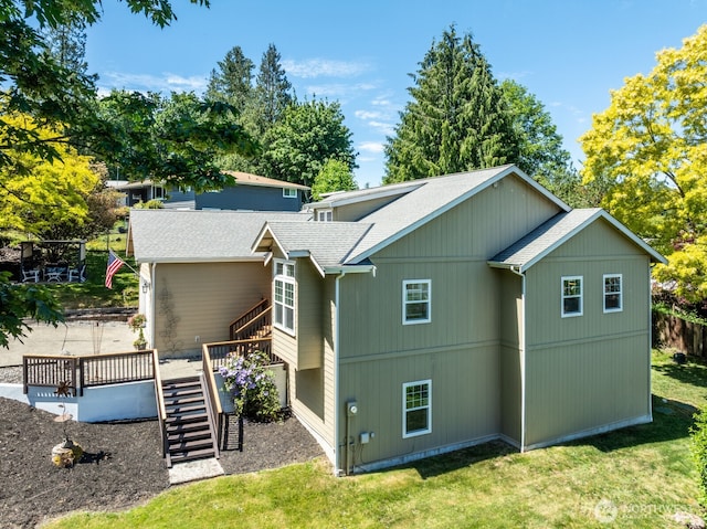 226 Alnus Way, Bremerton, WA 98310 - view of property exterior with stairway, roof with shingles, a deck, and a yard