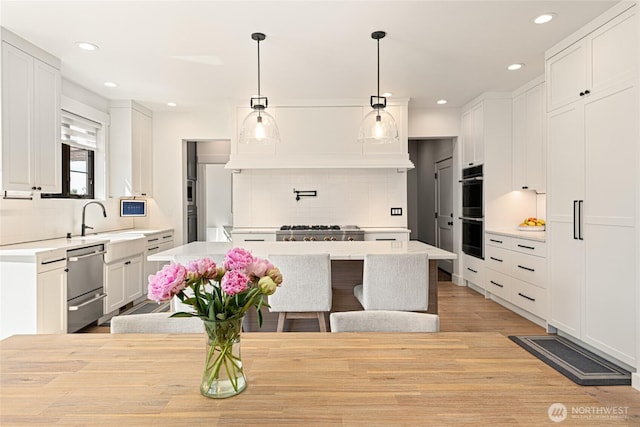 2140 Lagerwey Cir, Lynden, WA 98264 - kitchen featuring appliances with stainless steel finishes, decorative backsplash, light countertops, and recessed lighting