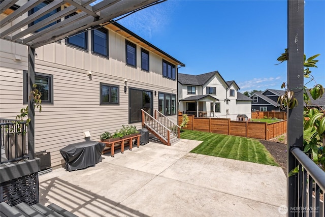 2140 Lagerwey Cir, Lynden, WA 98264 - rear view of property featuring board and batten siding, a residential view, and a patio area