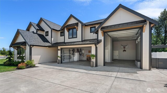 2140 Lagerwey Cir, Lynden, WA 98264 - modern farmhouse style home with a standing seam roof, concrete driveway, a metal roof, roof with shingles, and a garage