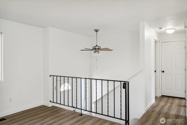 16931 20th Dr SE, Bothell, WA 98012 - hallway with wood finished floors, baseboards, and an upstairs landing