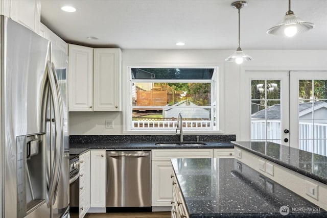 16931 20th Dr SE, Bothell, WA 98012 - kitchen featuring appliances with stainless steel finishes, a sink, white cabinets, hanging light fixtures, and recessed lighting