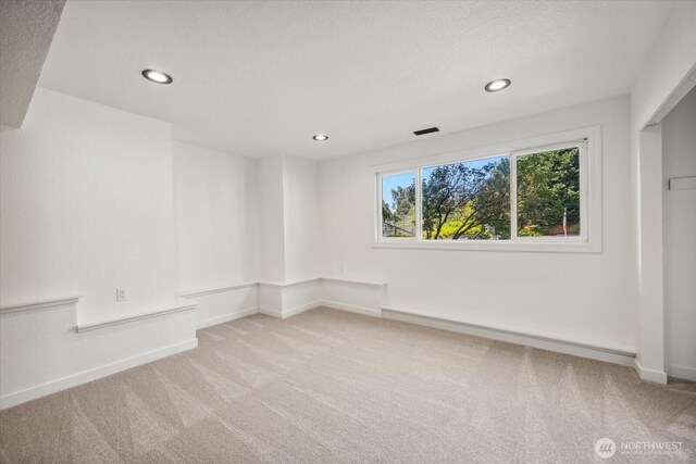 16931 20th Dr SE, Bothell, WA 98012 - carpeted empty room with recessed lighting, baseboards, and a baseboard heating unit