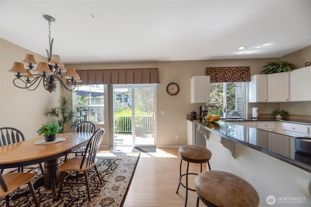 23777 SE 52nd Ln, Issaquah, WA 98029 - dining room featuring a chandelier, light wood finished floors, recessed lighting, and baseboards