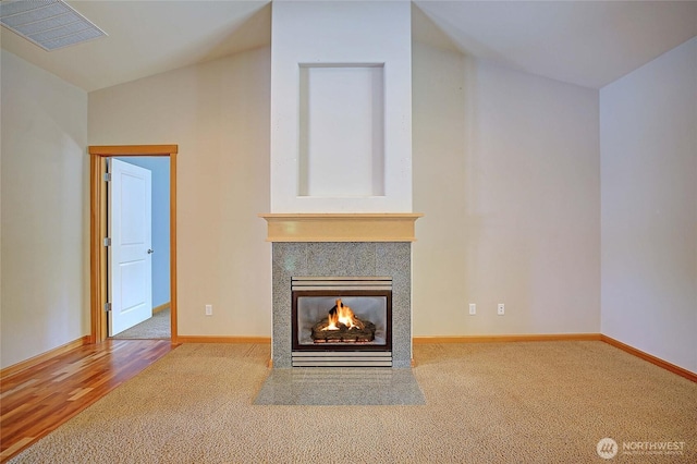 26306 2nd Ave NE, Arlington, WA 98223 - unfurnished living room with a multi sided fireplace and carpet