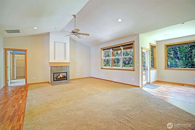 26306 2nd Ave NE, Arlington, WA 98223 - unfurnished living room featuring ceiling fan, a fireplace with flush hearth, lofted ceiling, light wood-style flooring, and recessed lighting