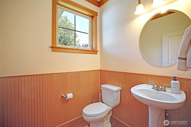 26306 2nd Ave NE, Arlington, WA 98223 - half bathroom featuring a wainscoted wall and wood finished floors