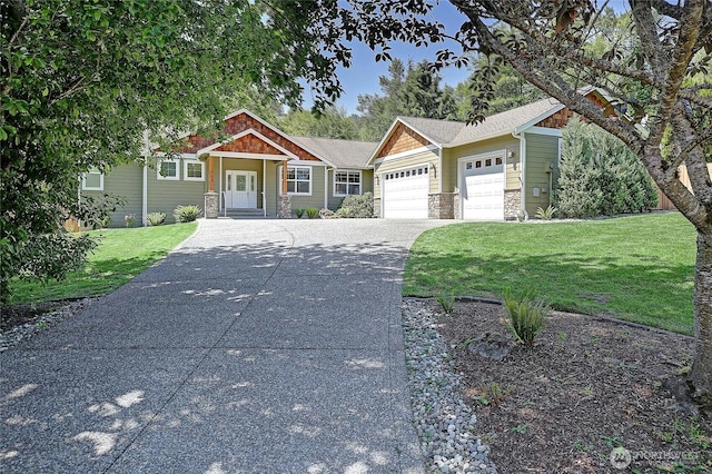 26306 2nd Ave NE, Arlington, WA 98223 - craftsman house featuring stone siding, a garage, driveway, and a front yard