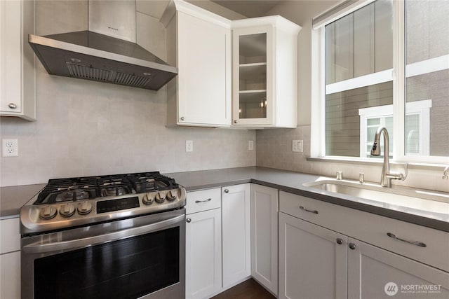 711 Blackstone Ln, Bellingham, WA 98226 - kitchen featuring stainless steel range with gas cooktop, wall chimney exhaust hood, a sink, and tasteful backsplash