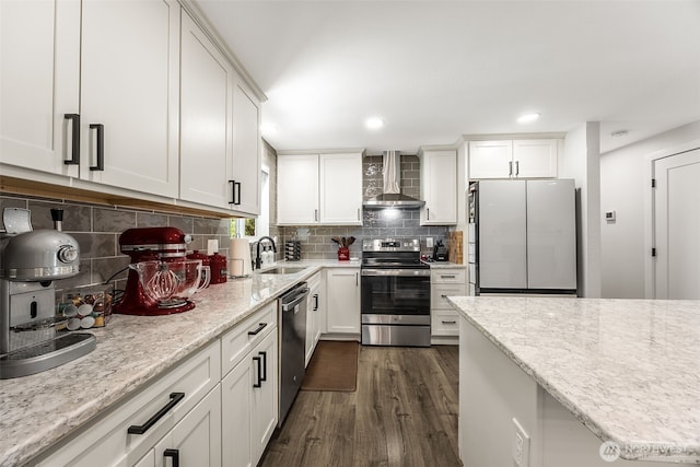 24028 6th Pl W, Bothell, WA 98021 - kitchen featuring wall chimney range hood, appliances with stainless steel finishes, a sink, dark wood-style flooring, and white cabinets