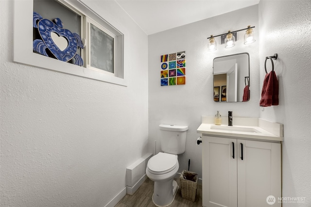 24028 6th Pl W, Bothell, WA 98021 - bathroom with vanity, wood finished floors, toilet, and baseboards