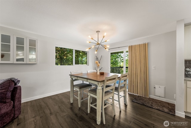 24028 6th Pl W, Bothell, WA 98021 - dining area featuring a chandelier, dark wood-style flooring, and baseboards