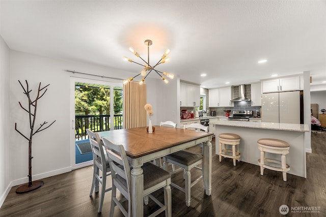 24028 6th Pl W, Bothell, WA 98021 - dining area featuring a chandelier, dark wood-style flooring, recessed lighting, and baseboards