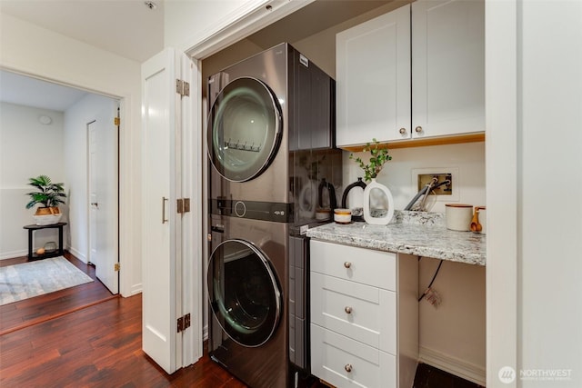 14251 73rd Ave NE Unit A101, Kirkland, WA 98034 - washroom with stacked washer and clothes dryer and dark wood finished floors