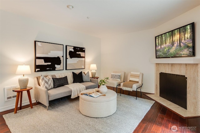 14251 73rd Ave NE Unit A101, Kirkland, WA 98034 - living area with wood finished floors and a fireplace