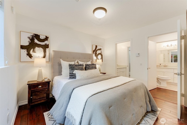 14251 73rd Ave NE Unit A101, Kirkland, WA 98034 - bedroom featuring ensuite bath and wood-type flooring