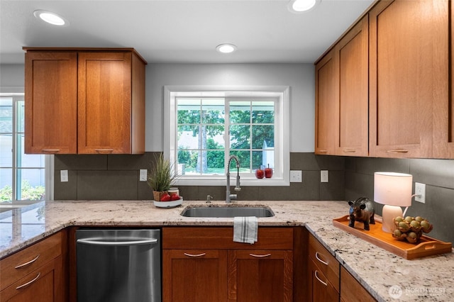 1484 SW Snively Ave, Chehalis, WA 98532 - kitchen featuring stainless steel dishwasher, a sink, plenty of natural light, brown cabinets, and recessed lighting