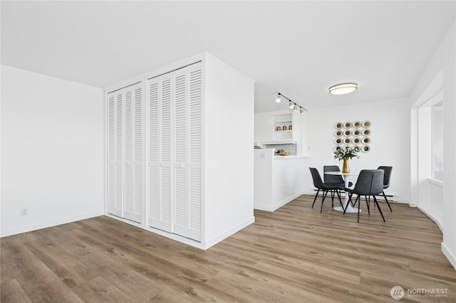 505 Belmont Ave E Unit 704, Seattle, WA 98102 - dining room with wood finished floors and track lighting