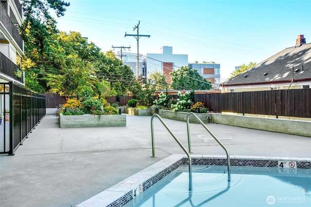 505 Belmont Ave E Unit 704, Seattle, WA 98102 - view of pool with a fenced backyard, a patio area, and a swimming pool