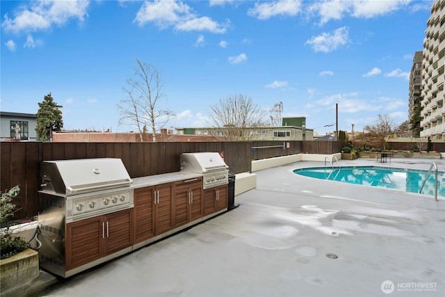 505 Belmont Ave E Unit 704, Seattle, WA 98102 - view of pool featuring area for grilling, a fenced backyard, and a patio