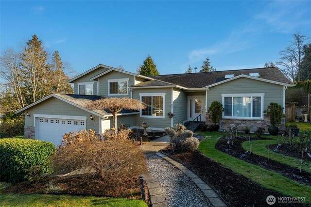 8148 Quinault Rd, Blaine, WA 98230 - view of front of house featuring a garage, stone siding, and a shingled roof