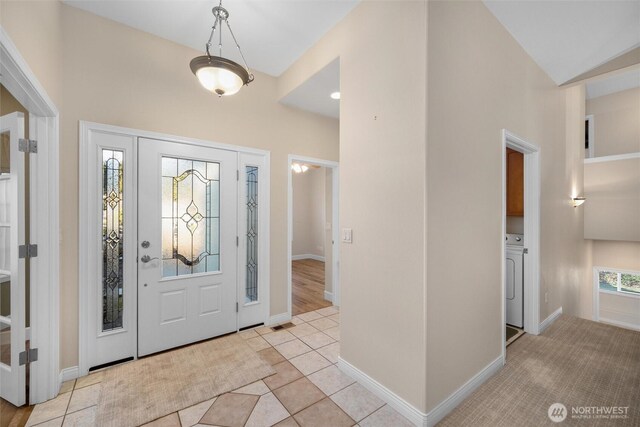 8148 Quinault Rd, Blaine, WA 98230 - foyer with washer / dryer, baseboards, and tile patterned floors