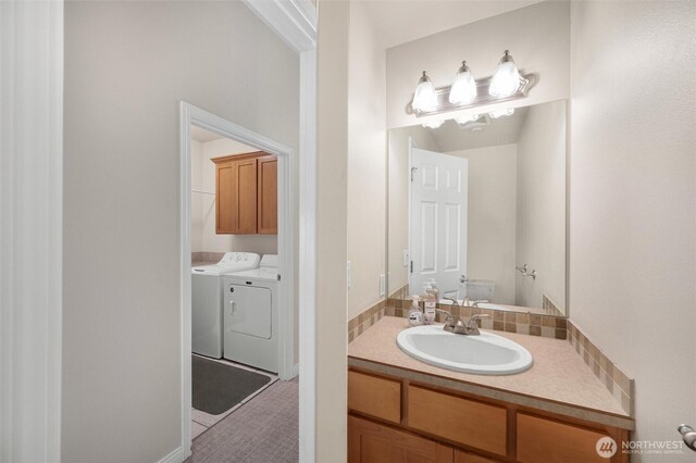 8148 Quinault Rd, Blaine, WA 98230 - bathroom featuring washer and dryer and vanity