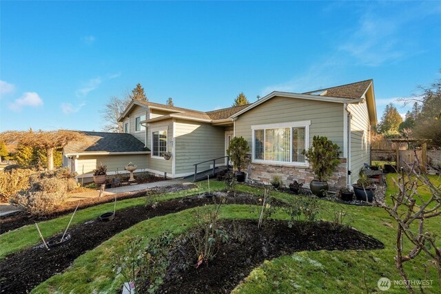8148 Quinault Rd, Blaine, WA 98230 - view of side of property with a lawn and stone siding